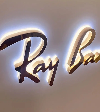 Customized outdoor advertising LED backlit signs with acrylic channel letters and neon light sources, made of stainless - steel material.